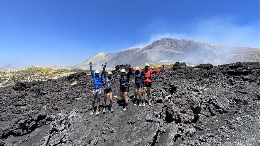 Etna 3300 hike clients happily jumping at The Top of Mount Etna Etna 3300 hike clients happily jumping at The Top of Mount Etna